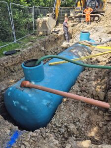 Septic tank lowered into ground